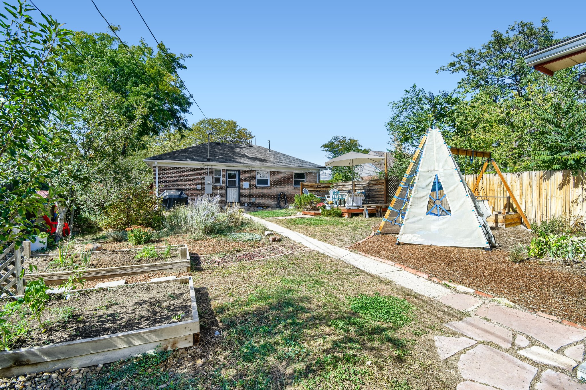 Back yard with raised garden beds