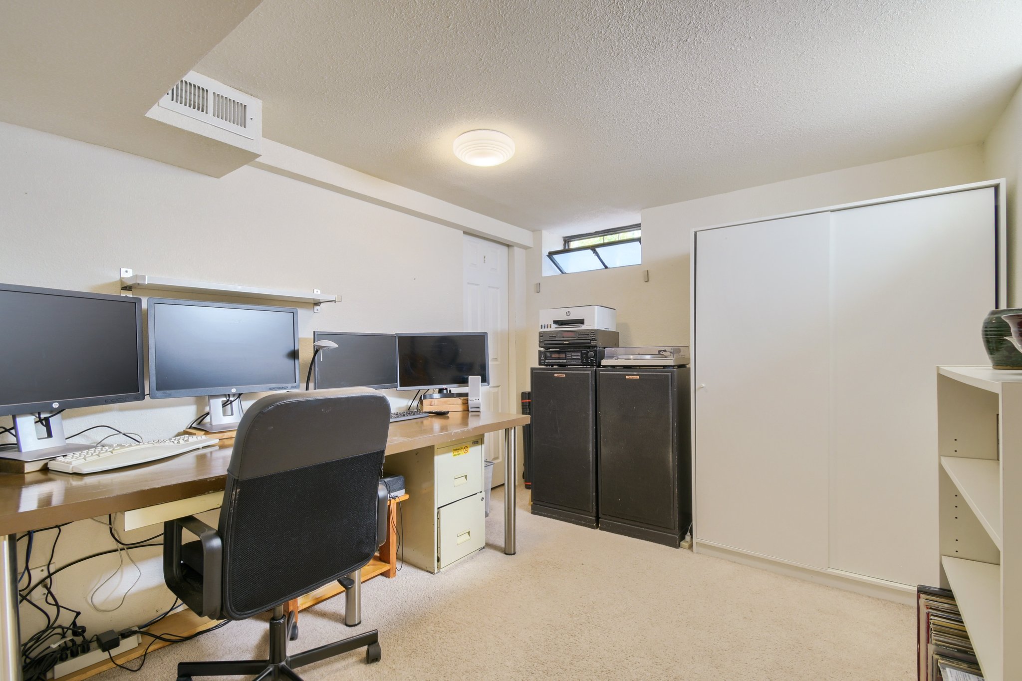 Basement non-conforming bedroom, set up as an office