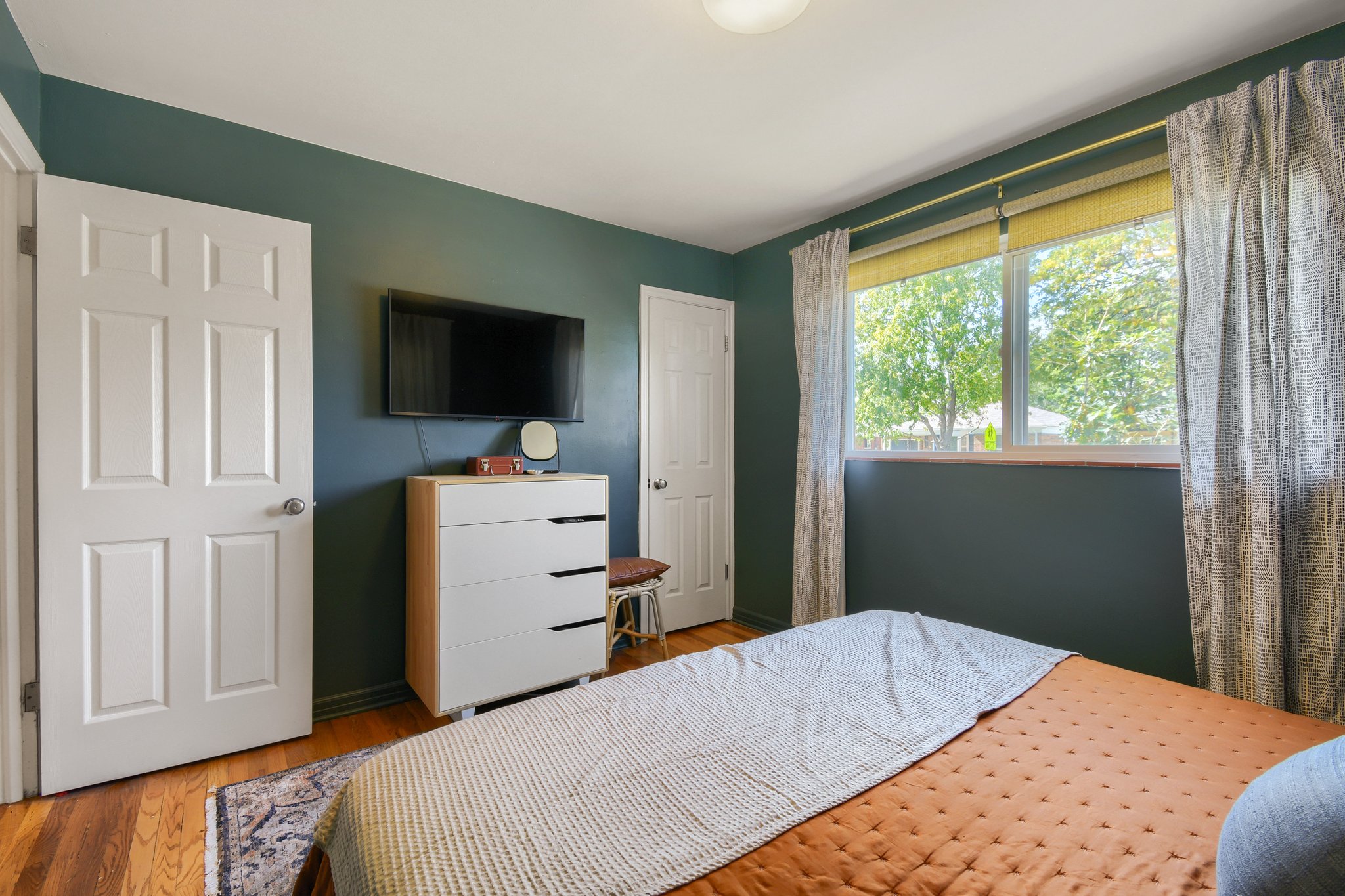 Primary bedroom with windows on two walls
